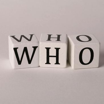 Three blocks on a white background with the letters 'W' 'H''O' on each block