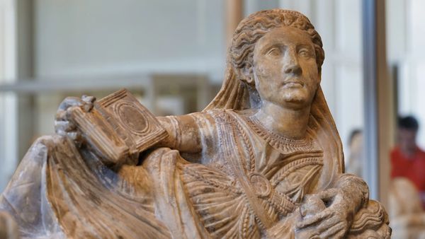 woman sculpture in the etruscan civilization room in the Louvre