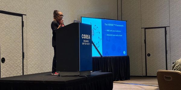 Presenter speaking at a conference in Orlando.