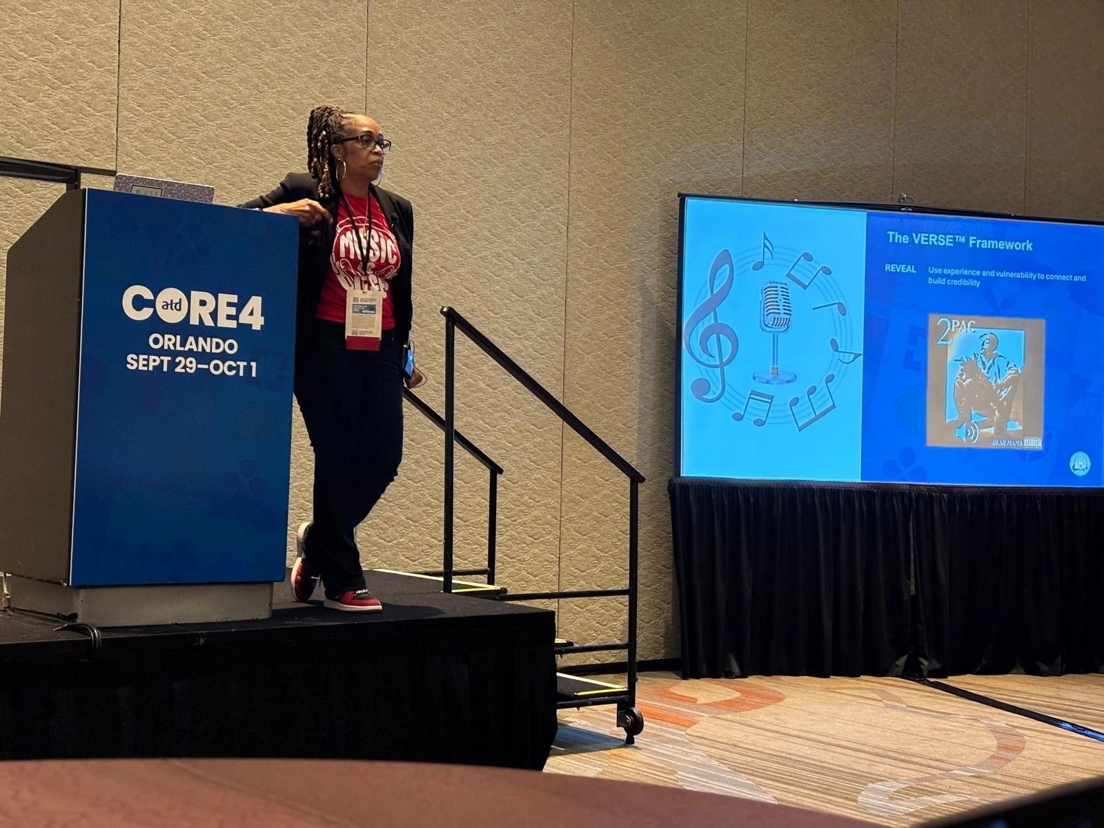 Dr. Tekeisha Zimmerman presenting on the VERSE Framework at a conference in Orlando.