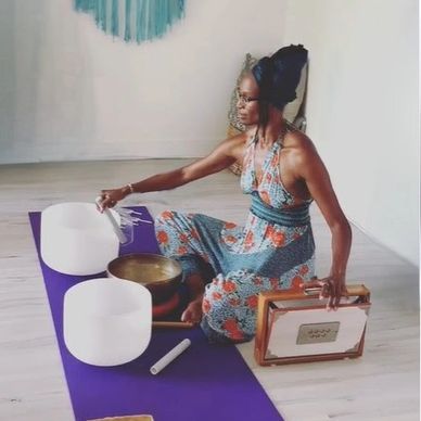 Keema playing sound healing tools for women receiving pelvic steaming in Kailua Hawaii