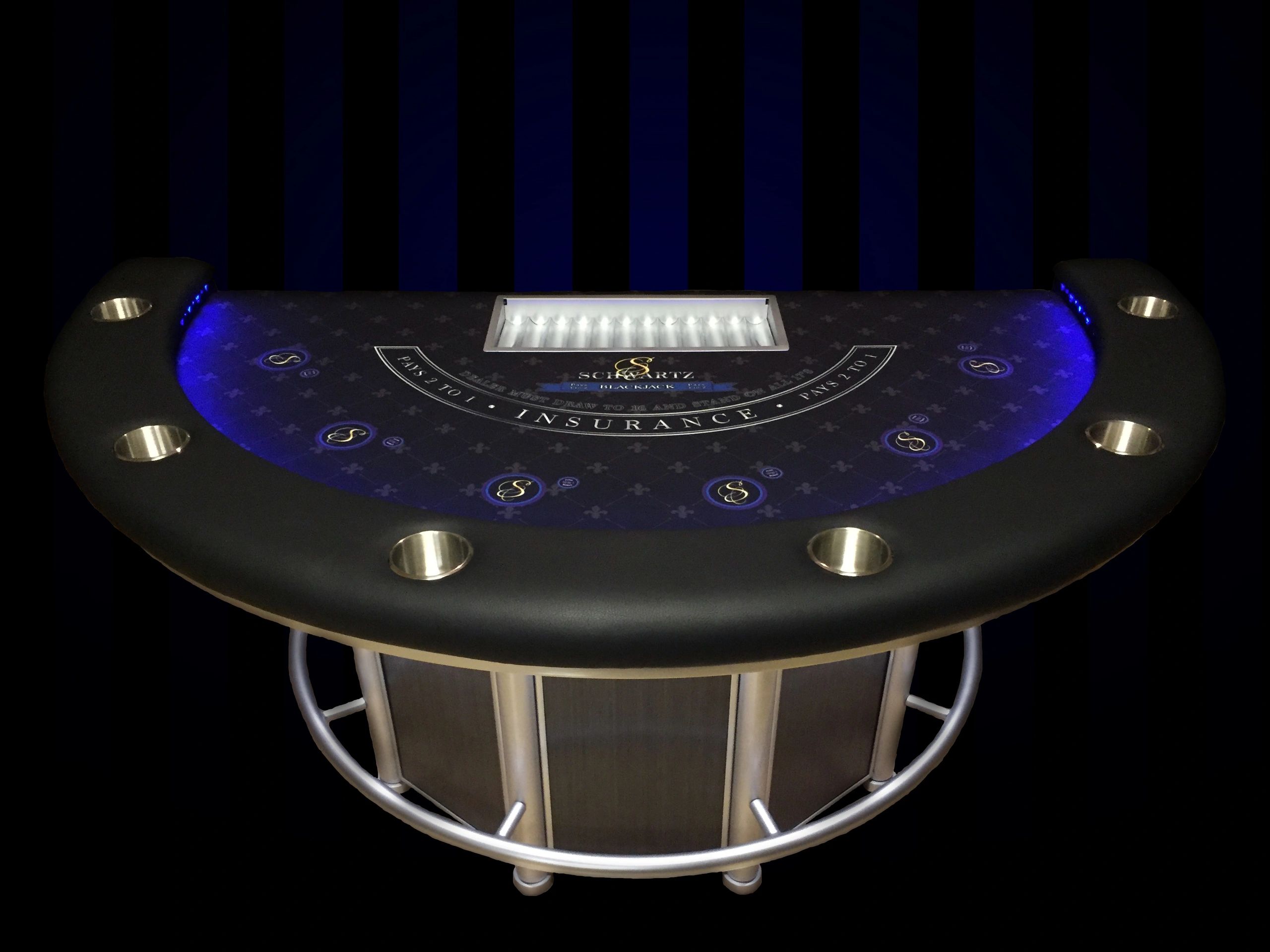 A sleek blackjack table with illuminated chip placements.