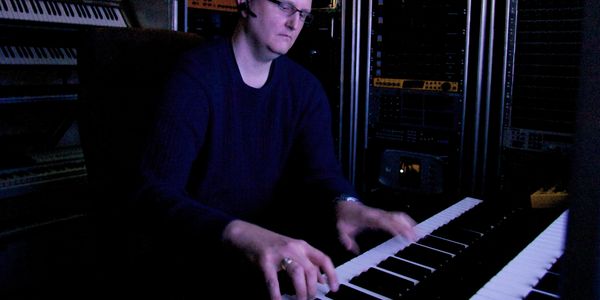 Mark V Sheldon, fun online music teacher composing on piano, synthesizers, and Pro Tools