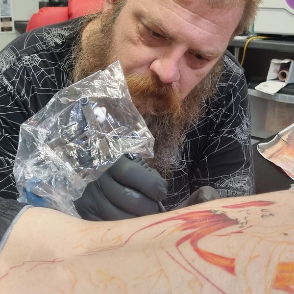 Tattoo artist at work
Tattooist working
Professional tattoo studio 