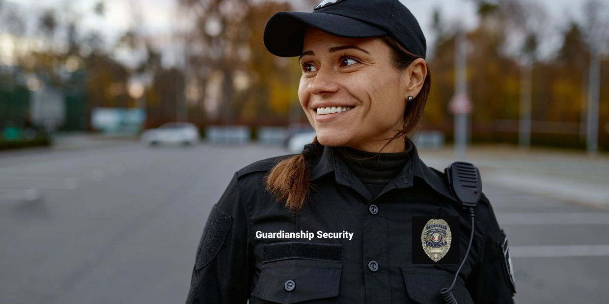 Smiling female security officer in uniform outdoors.