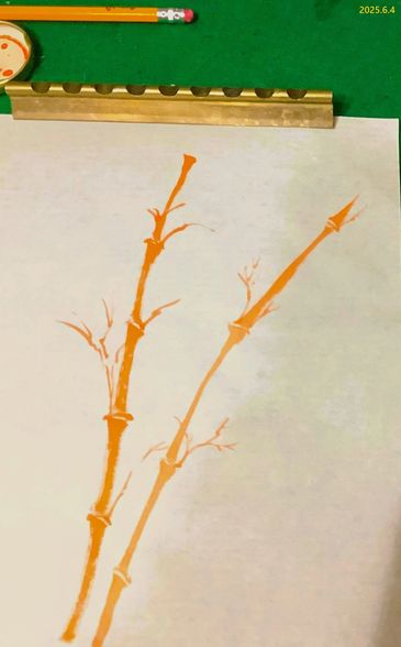 Artistic orange bamboo stalks painted on a white sheet with green background.