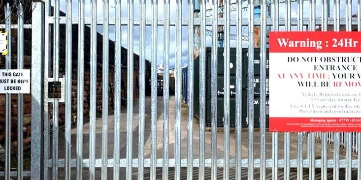 the entrance to a secure gated compound