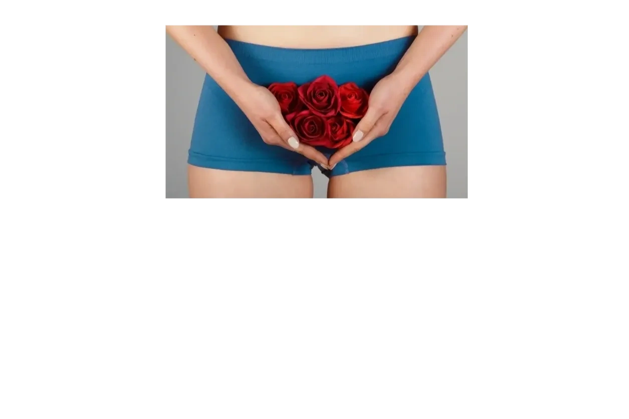 Woman in blue exercise shorts holding euphemistic roses over uterus, vagina area for Pelvic Health