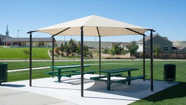 Shade canopy in neighborhood park picnic area.