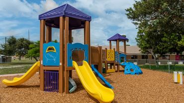 An installation of a commercial playground at a school