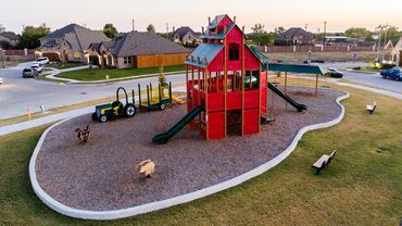 Installation of a commercial playground in a residential area.