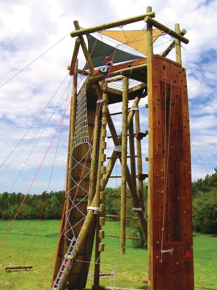 Tango tower in Texas with climbing wall face, cargo net climb, bead climb, and giant ladder.