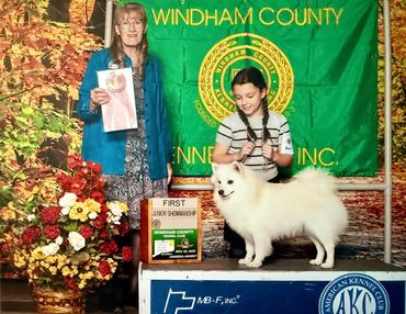Woman, girl, and dog at Windham County dog show.