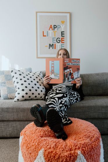 Karla McCullum sitting reading a book. Photography by THESE ARE THE DAYS PHOTOGRAPHY.