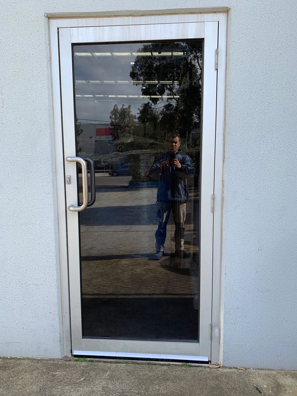 Factory Door grey laminated safety glass replaced in Thomastown