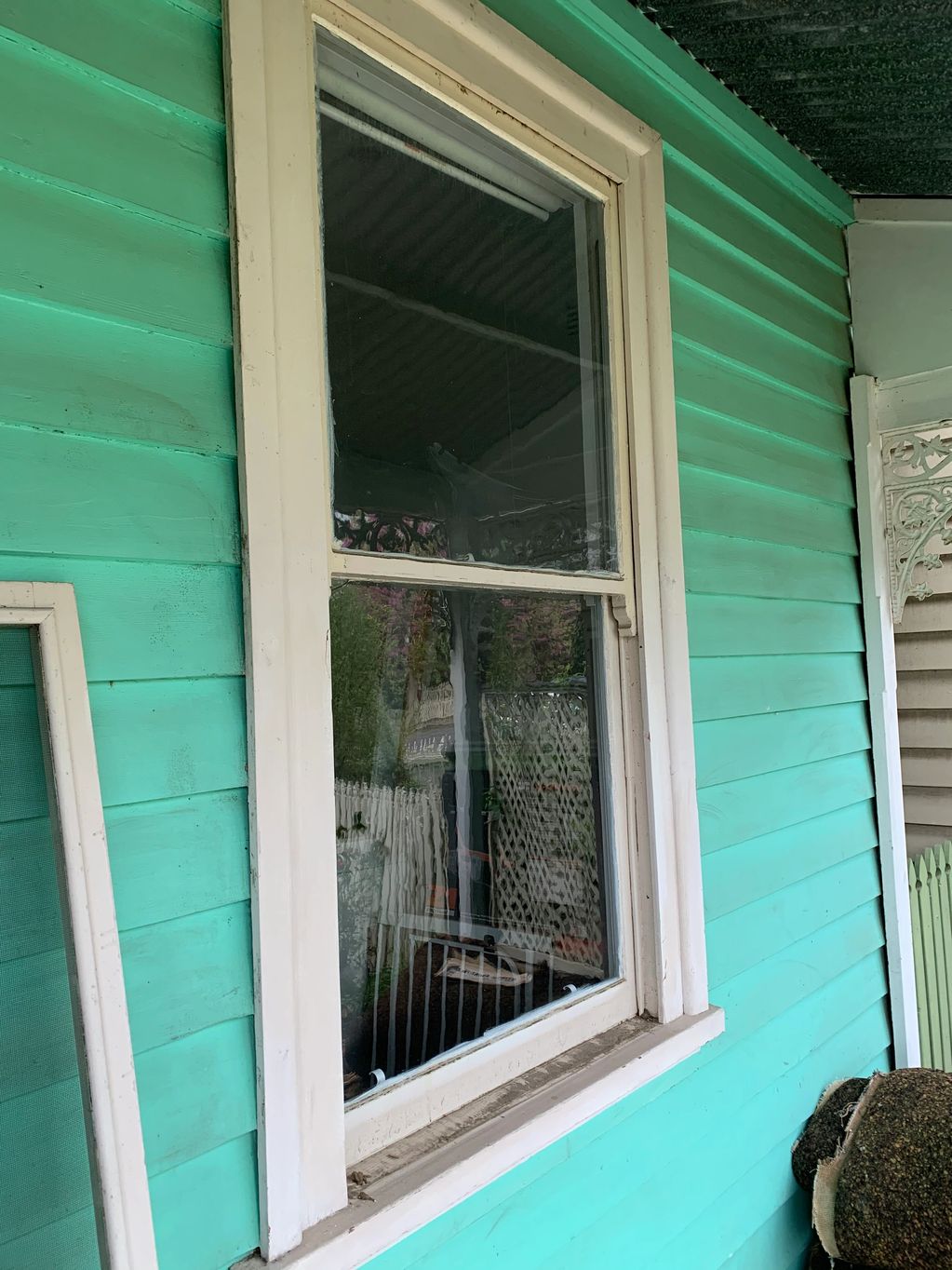 Removal  of original  glass in old federation style property ready for new clear glass.