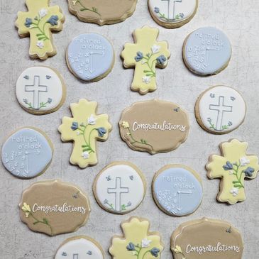 Decorative cookies with crosses, flowers, and congratulations messages.