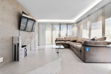 living room with new flooring & soffit with custom lighting