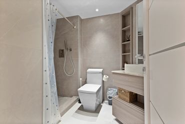 custom bathroom with new shower and toilet.