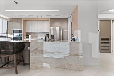 Quartzite countertops with custom lighting in a new kitchen