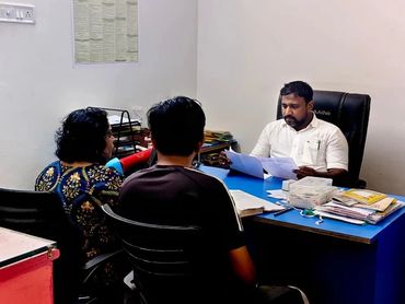 Advocates discussing case strategy, reviewing documents, and preparing legal proceedings with client