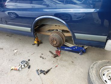 Starting a brake job on a Chevy. 