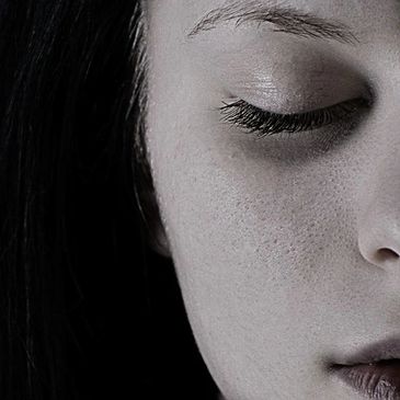 Woman with closed eyes.