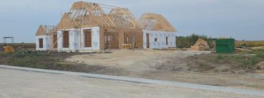 Duplex condo framed and sheathed on a new street