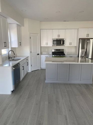 Kitchen sink wall and island in a new duplex condo