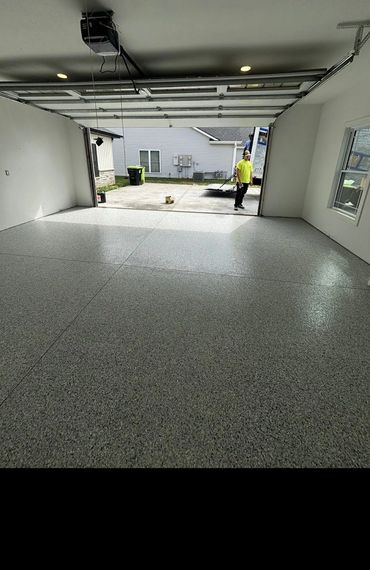 Garage with a new flake epoxy floor and finished walls
