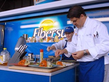 Chefs Stormy & Marti Mongiello working on & off stage for P&G with up to one million guests daily.