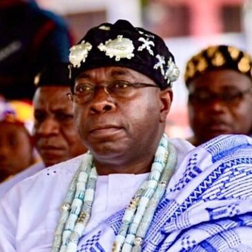 Togbi Nyaho Tamakloe VI is pictured wearing his blue and white traditional African clothing.