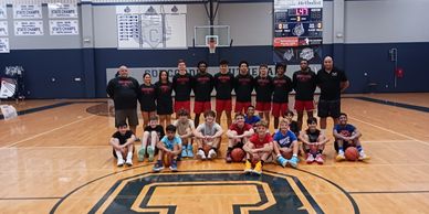 Group photo of students and coaches at the Keith Coleman Basketball Coaching Academy.