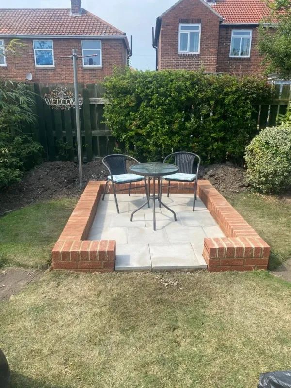 Small Garden with newly installed paving with table and chairs