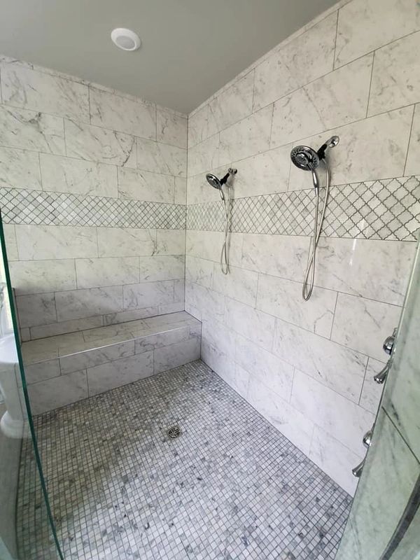 white marble stone tile in custom shower