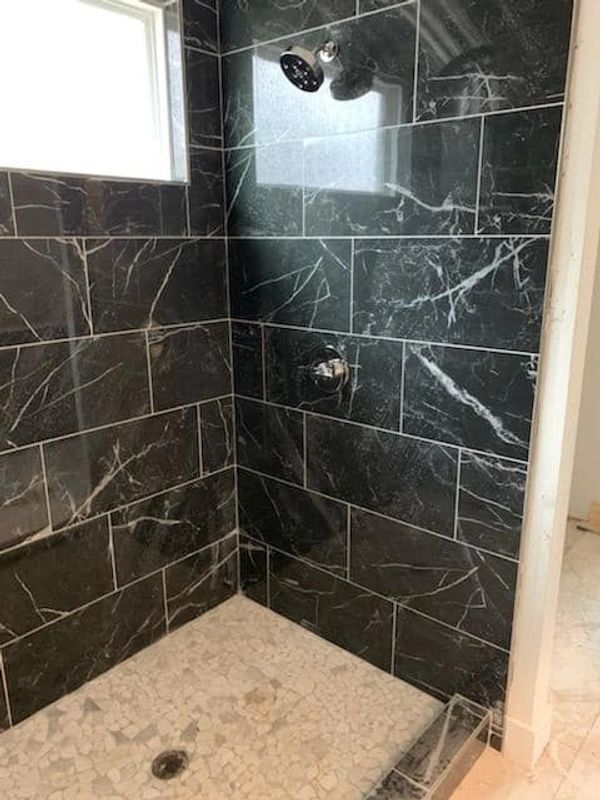 polished marble in custom shower