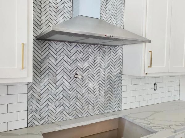 herringbone marble backsplash