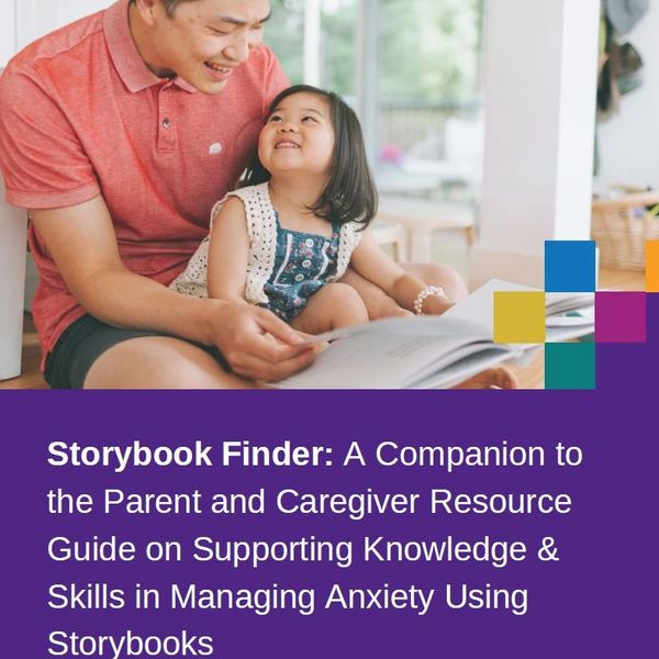 Father and daughter sharing a joyful moment with a storybook.