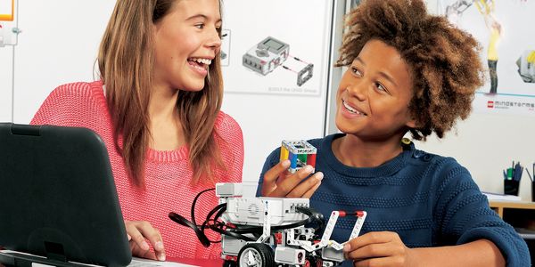 Robotics teacher working with students