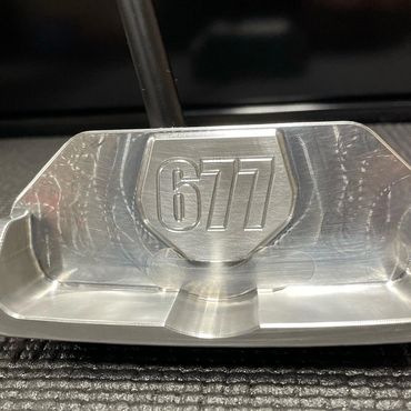 Custom golf putter with customer name or number engraved on it.