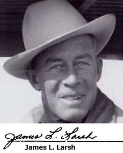 Black and white photo of a man wearing a hat and smiling.