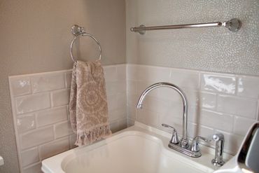 Installed tile backsplash in laundry room