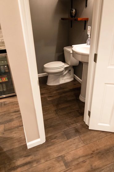 Bathroom renovation with porcelain tile floor installation