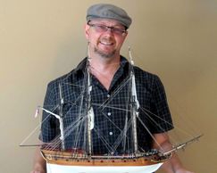 Jarod Matwiy with finished ship model.