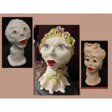 clay heads of women with red lips