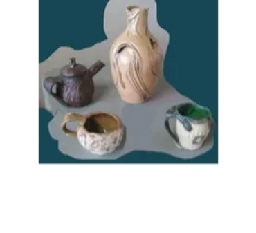 a collection of four different clay mugs