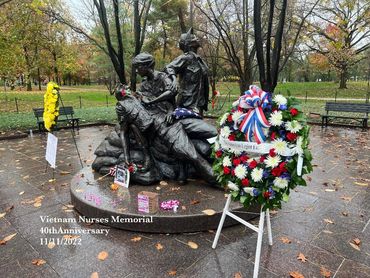 Vietnam Women's Memorial. Three uniformed women Nurses with a wonder soldier.