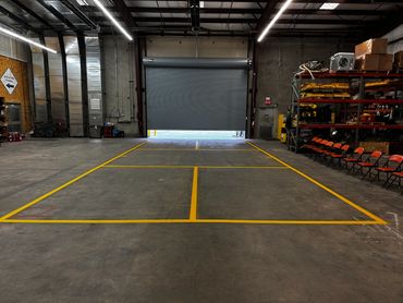 Pickleball court striping in a warehouse in Ogden, UT.