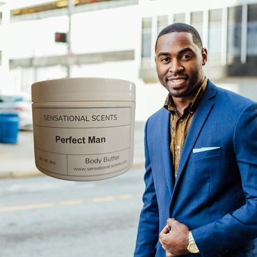Confident man in a blue suit with a jar of Perfect Man body butter.