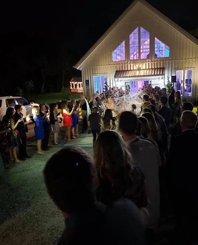 Uplighting at the bride and grooms exit at Aurora Farms in Taylors, SC